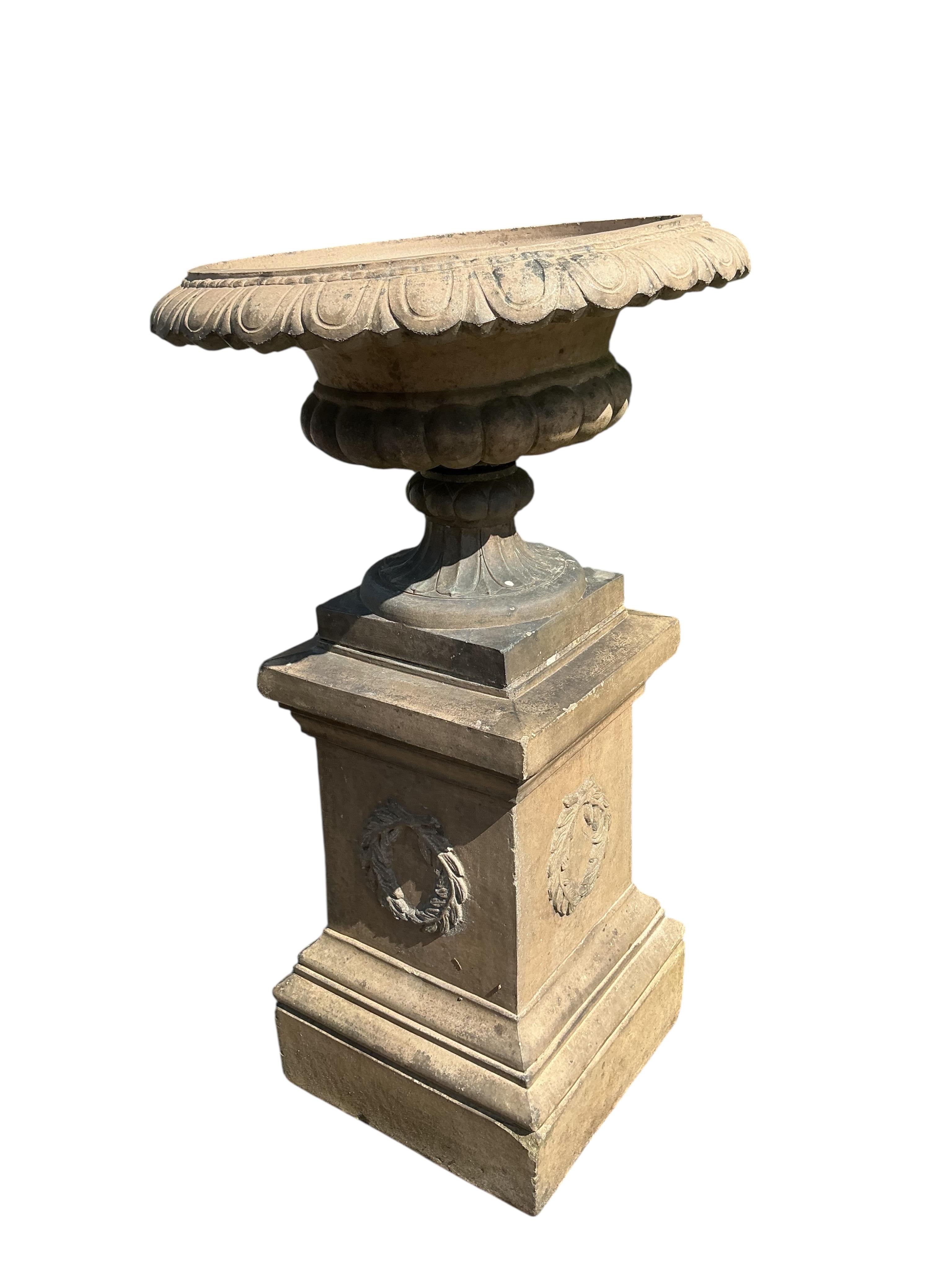 A Victorian Gibbs & Canning, Tamworth earthenware garden campana urn, on square pedestal base, diameter 65cm, height 113cm